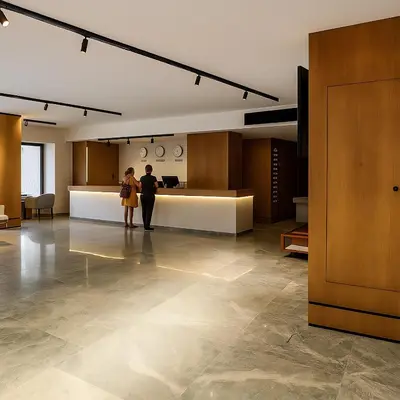 two people are standing in a large room at Selena Bay Luxury Sea View 1BR Apartment, Private Beach and Pool in Hurghada