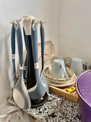 a group of utensils sitting on top of a counter at Super Elite apartment - Aswan city center apartments in Aswan