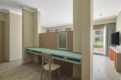 a room with a desk with a mirror and a chair at Doubletree By Hilton Mangroovy El Gouna Resort in Hurghada