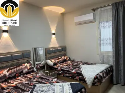 a bedroom with two beds and a window at CAMUS 243, Princess Resort in Hurghada