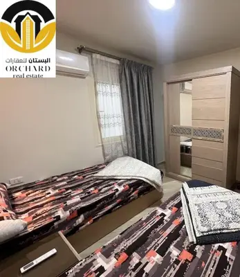 a bedroom with a bed and a dresser at CAMUS 243, Princess Resort in Hurghada