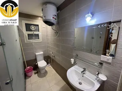 a bathroom with a sink and a toilet and a mirror at CAMUS 243, Princess Resort in Hurghada