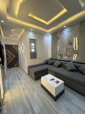 a living room with a couch and a coffee table at BS Lodging 8- Next to Dream Beach in Hurghada