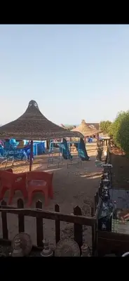 a view of a playground with tables and umbrellas at Mo Asha in Safaga