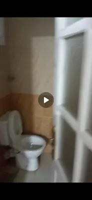 a bathroom with a toilet with a hole in the wall at Mo Asha in Safaga