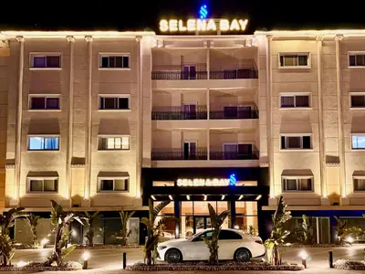 a white car parked in front of a building at Comfy Studio, Pools, private Beach at peaceful Resort in Hurghada