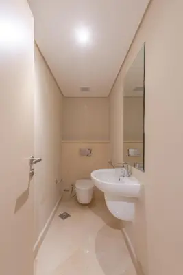 a bathroom with a sink and a toilet at Elegant apartment with pool and beach access in Hurghada