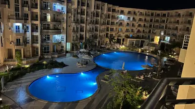 an overhead view of a swimming pool at night at Princess Resort Hurghada in Hurghada