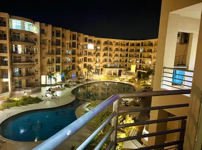 a view from a balcony of a hotel at night at Princess Resort Hurghada in Hurghada