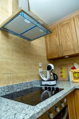 a kitchen with a mixer on top of a counter at El Andalous Sea View Apartment Sahl Hasheesh in Hurghada