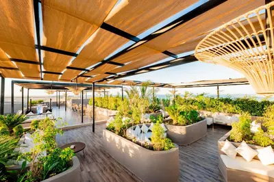 an outdoor patio with plants in pots on a building at Sentido Naga Bay - Adults friendly in Hurghada