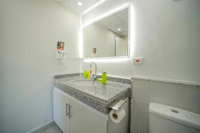 a bathroom with a sink and a mirror at Hurghada-Scandic Resort-The Diamond Of Scandic Apartment -Sea veiw&Sandy Beach Just Downstairs in Hurghada