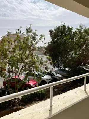 a view of cars parked in a parking lot at Sea Life Apartments-hotel in Hurghada