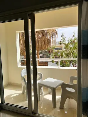 a view of a balcony with a table and chairs at Sea Life Apartments-hotel in Hurghada