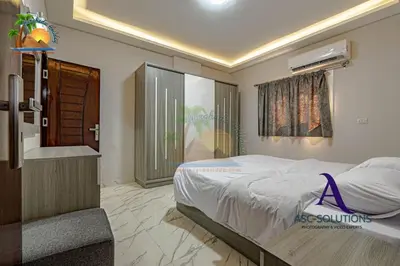 a bedroom with a large bed and a window at The Awesome 3-Bedroom Apartment & 2 bathroom in Al-Ahyaa Hurghada in Hurghada