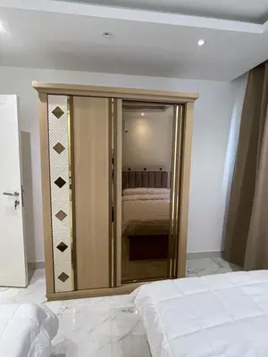 a bedroom with a mirrored closet with a bed in it at Fanadir Bay in Hurghada