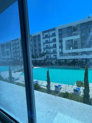 a view of a swimming pool from a window at Fanadir Bay in Hurghada