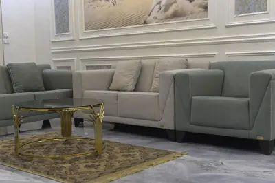 a living room with a couch and a table at برج النيل بزنس in Jazīrat al ‘Awwāmīyah
