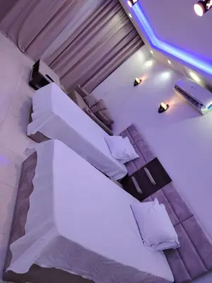 an overhead view of a bed with white sheets and pillows at شاليه ب Selena Bay Resort in Hurghada