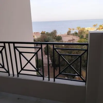 a balcony with a view of the ocean at جوليانا بيتش ريزورت in Hurghada