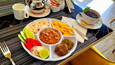 a tray of food with different types of food on a table at جوليانا بيتش ريزورت in Hurghada