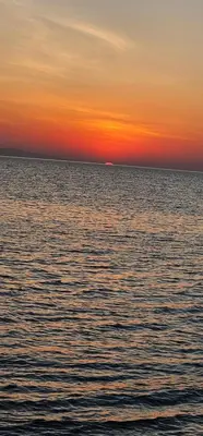 a sunset over a large body of water at Selena Bay Resort Chalet in Hurghada