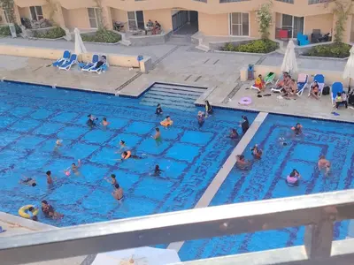 a group of people in a swimming pool at Selena Bay Resort Chalet in Hurghada