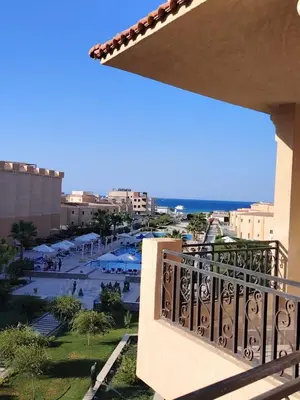 a balcony of a building with a view of a courtyard at Selena Bay Resort Chalet in Hurghada
