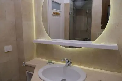 a bathroom with a sink and a mirror at Cozy Townhouse in West Golf - El Gouna in Hurghada