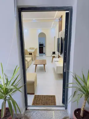 a view of a living room with a mirror at Moly House in Aswan
