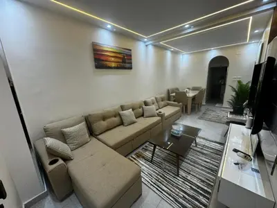 a living room with a couch and a table at Moly House in Aswan