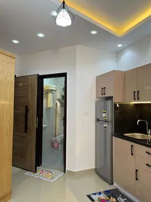 a kitchen with a stainless steel refrigerator and a sink at Juliana Beach Aqua park in Hurghada