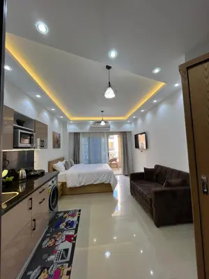 a large living room with a bed and a couch at Juliana Beach Aqua park in Hurghada