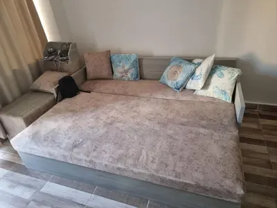 a large bed with pillows on it in a room at Camelgila Appartment Royal Residence in Port Ghalib