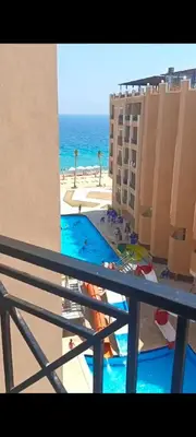 a view of the ocean from a balcony of a hotel at Juliana beach in Hurghada