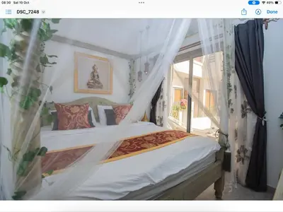 a bedroom with two beds and a window at Lavish suite 97m wifi sea view apt boutique resort in Hurghada