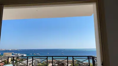 a view of the ocean from a window at Sea view apartment 10 , in city center front of the sea F 10 in Hurghada