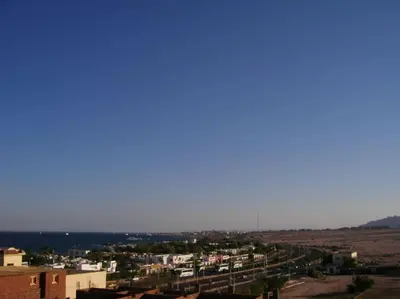 a view of a city with buildings and the ocean at Desert Rose Apartment in Hurghada