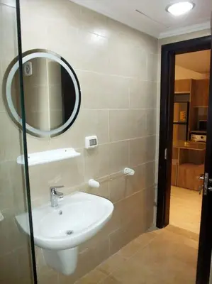 a bathroom with a sink and a mirror on the wall at Jomana Aldau Heights Hurghada rent one bedroom apartment in Hurghada