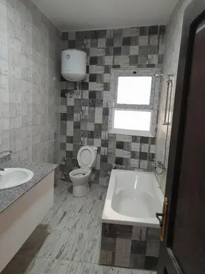 a bathroom with a tub and a toilet and a sink at Sea view apartment 09 , in city center in front off the sea 09 in Hurghada