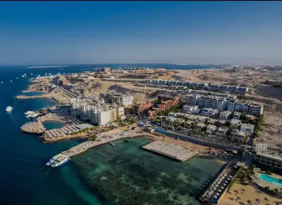an aerial view of a resort in the ocean at Sea view apartment 09 , in city center in front off the sea 09 in Hurghada