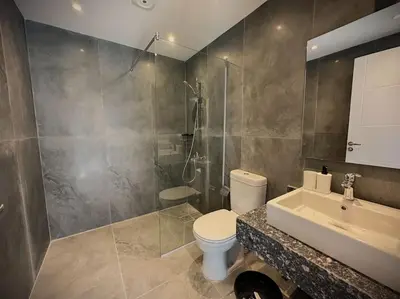 a bathroom with a toilet and a shower and a sink at Unique 2BR Villa - Private Pool In Bali-ElGouna in El Gouna