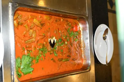 a glass dish of soup in a microwave at Mirage Bay Mina Land Resort & Aquapark in Hurghada