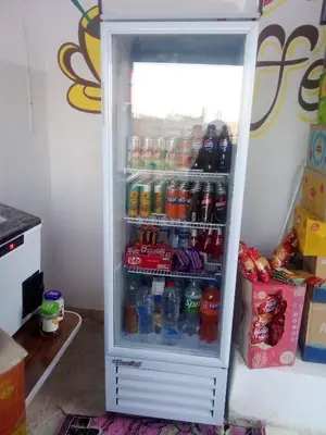an open refrigerator filled with lots of drinks at Nubian Life Nile View in Aswan
