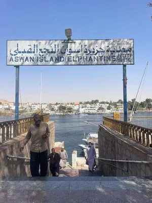 a group of people standing on a bridge near the water at Nubian Life Nile View in Aswan