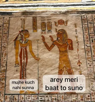 a painting of two people on a wall at Nubian Life Nile View in Aswan