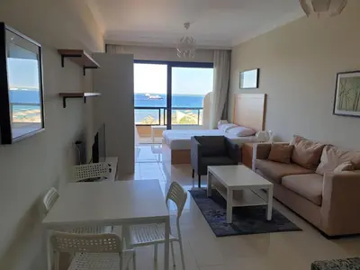 a living room with a couch and a table at Studio for rent 202 in Hurghada