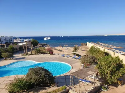 a view of a swimming pool and the ocean at Studio for rent 202 in Hurghada
