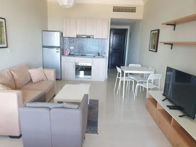 a living room with a couch and a table at Studio for rent 202 in Hurghada