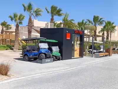 a golf cart parked in front of a gas station at Mesca Chalet Soma Bay in Hurghada